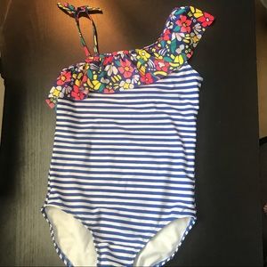 One piece swim suit with ruffles.